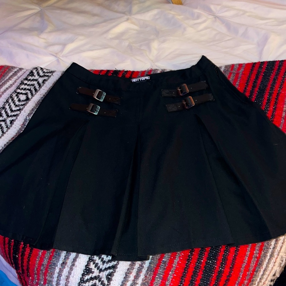 Black Hot Topic skirt with pleats and buckles.